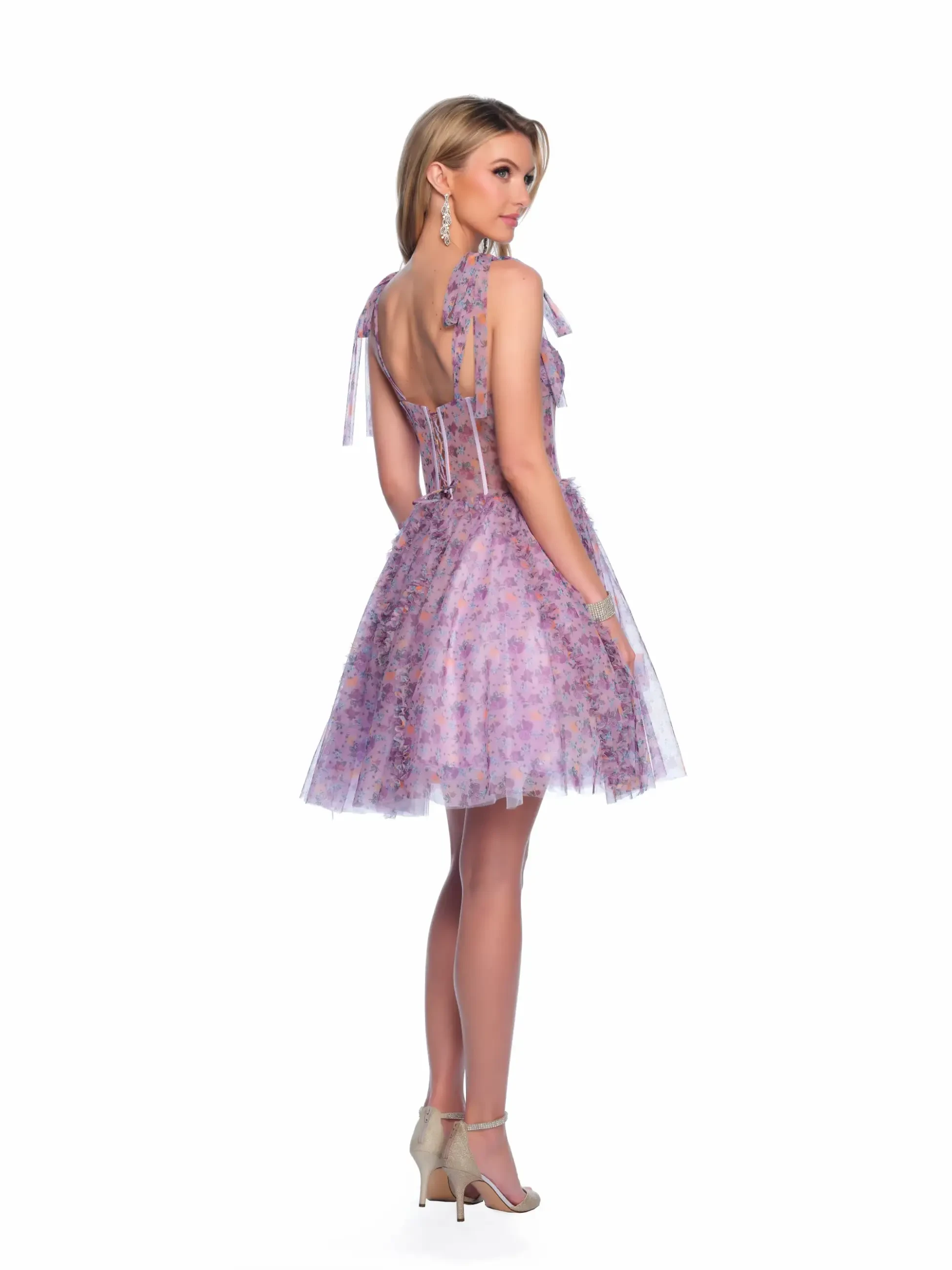 model is wearing a purple corset mini homecoming dress