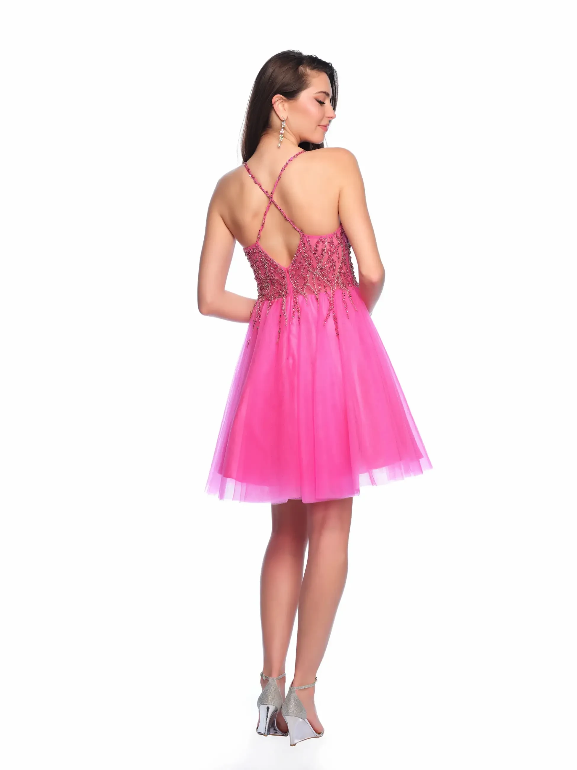 model is wearing a short hot pink homecoming dress