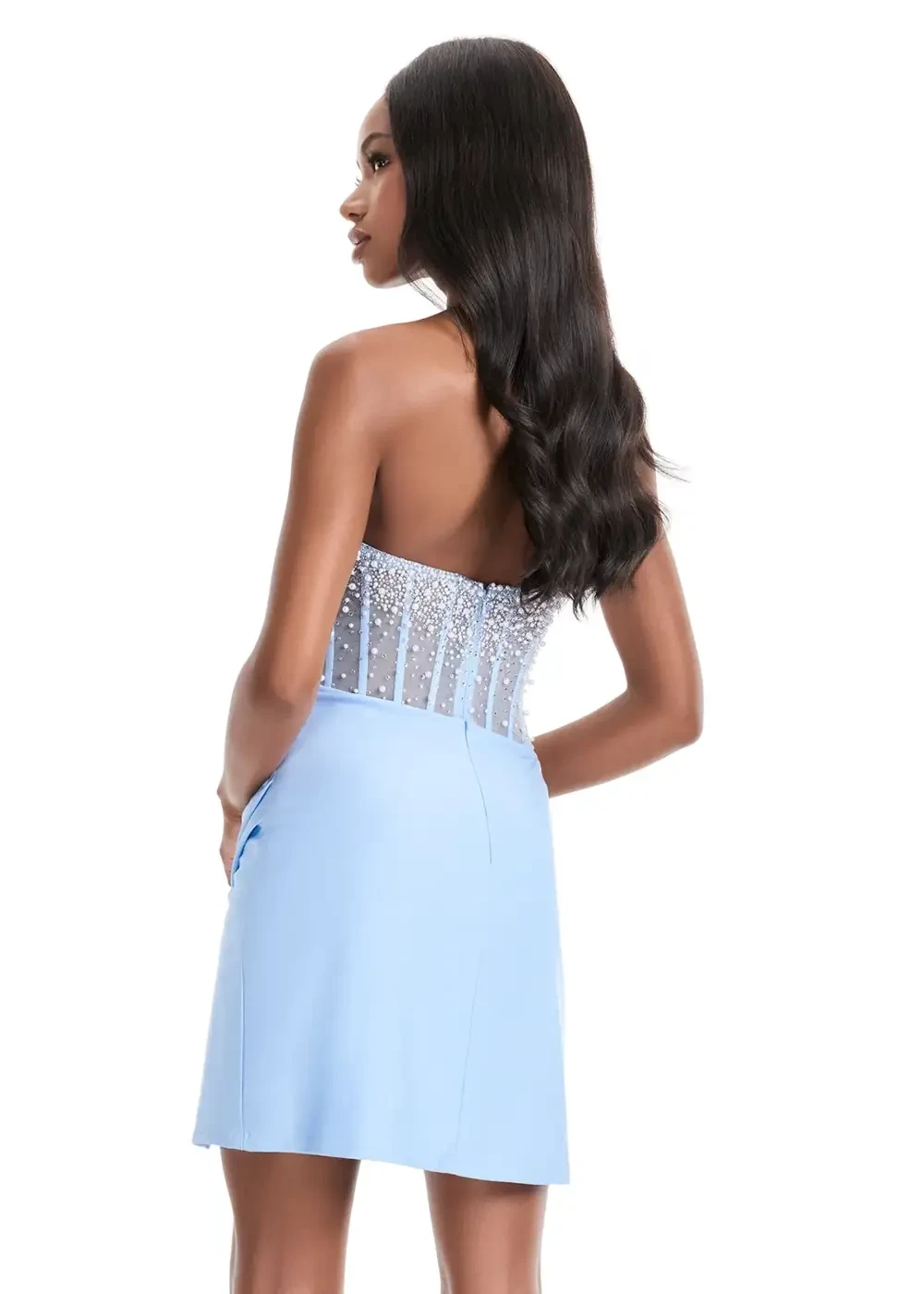 A model is wearing a strapless light blue dress with a beaded bodice and a fitted skirt.