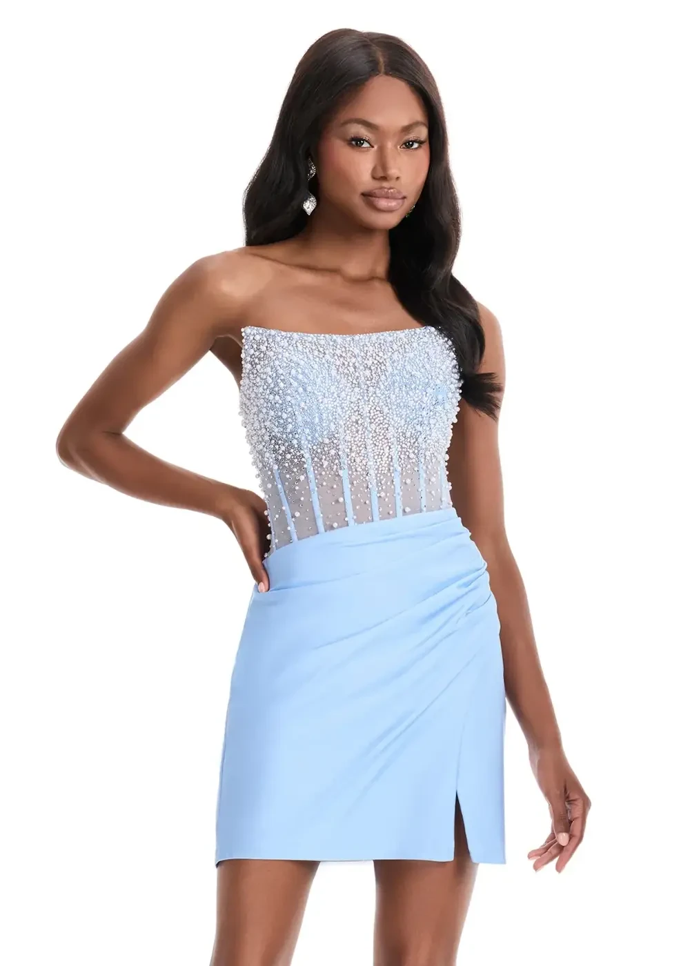 A model is wearing a strapless light blue dress with a beaded bodice and a fitted skirt.
