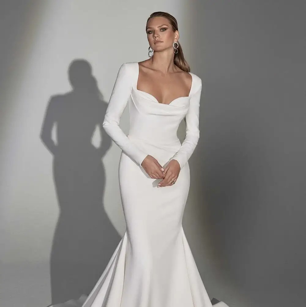 Model wearing a white gown by Justin Alexander Signature