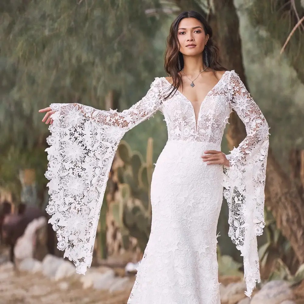 Model wearing a white gown by Lillian West