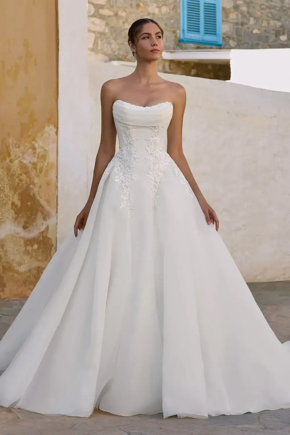 Model wearing a white gown by Lillian West