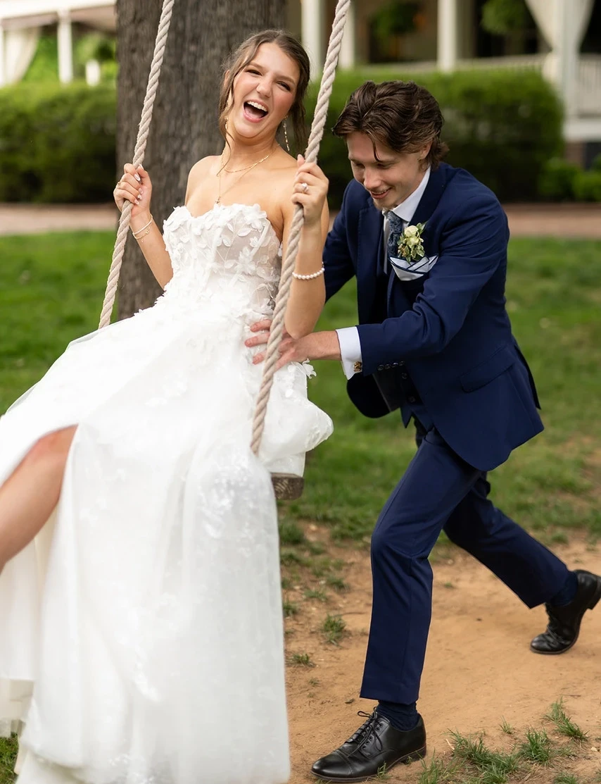 Сouple wearing a white gown and a blue suit