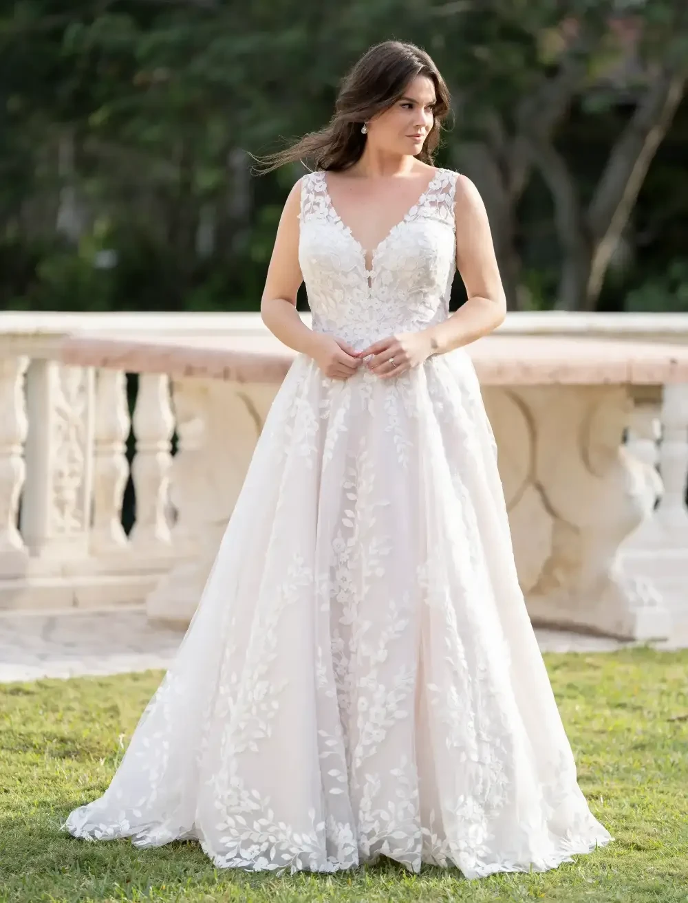 Model wearing a white gown