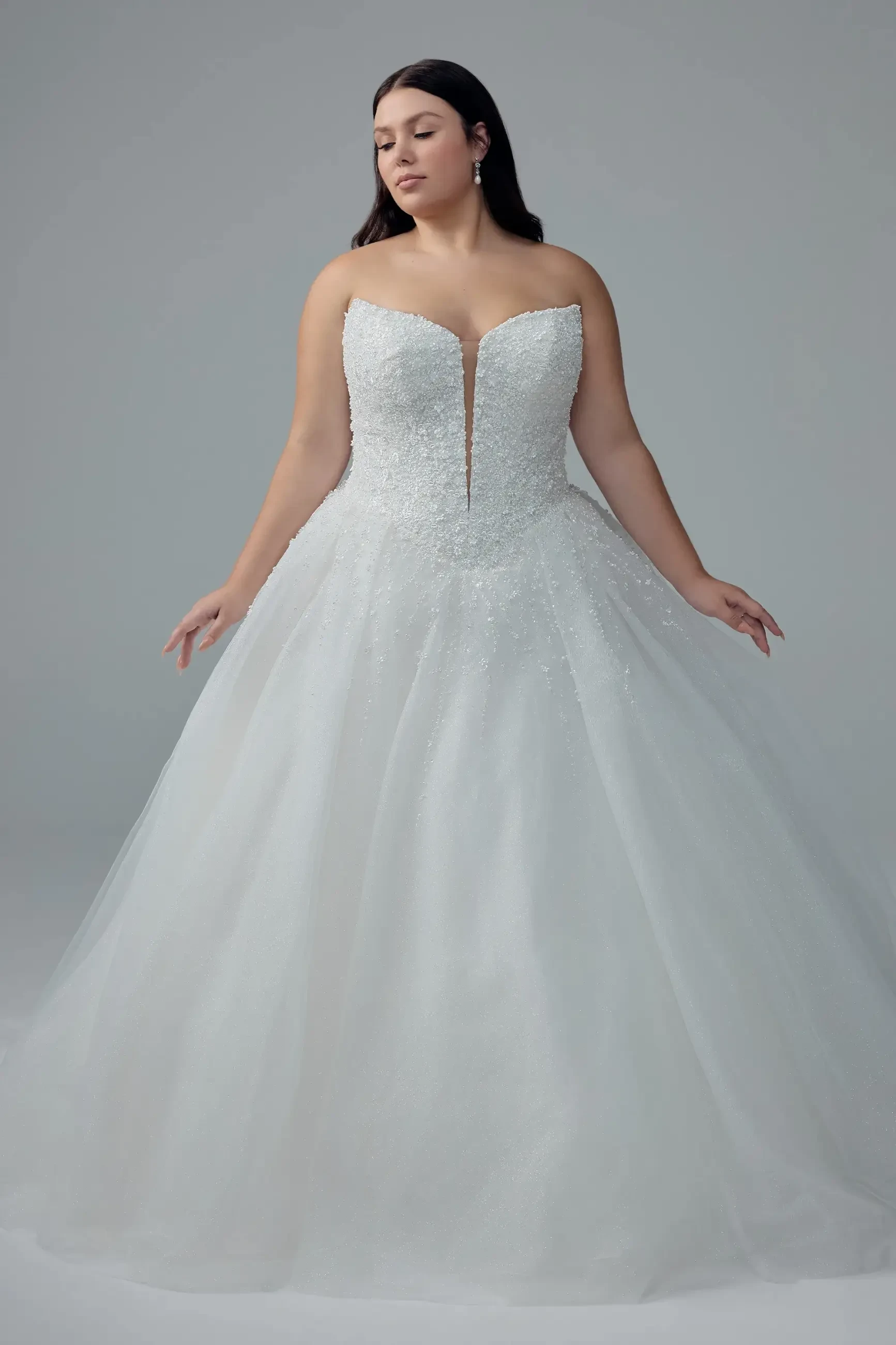 model is wering a strapless a-line wedding dress